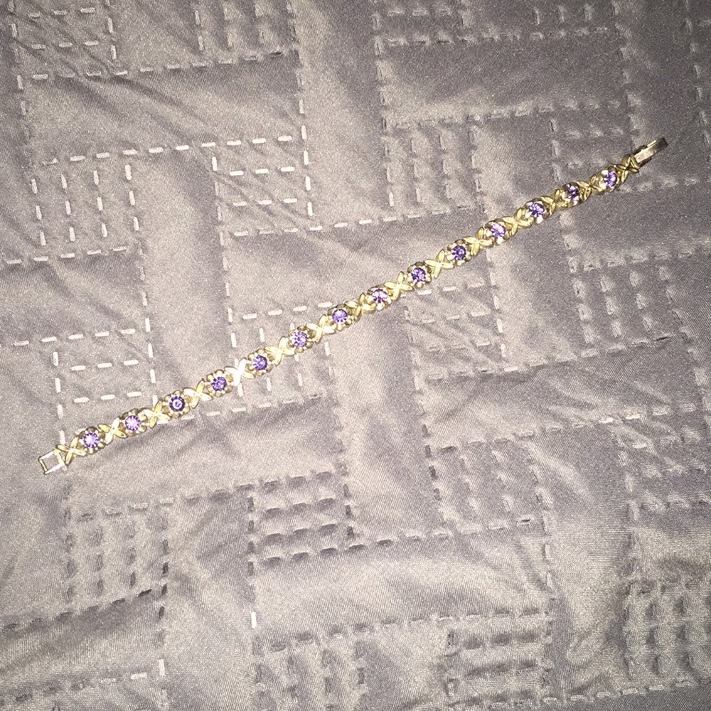 Gold link bracelet with purple gems